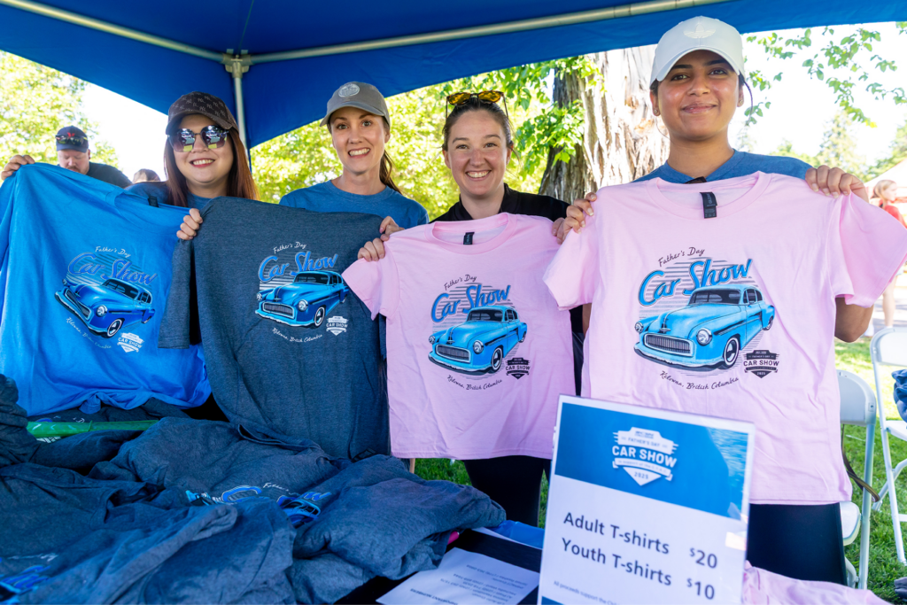 Lift Auto Group Team holding up 2025 Car Show Tshirts