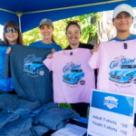 Lift Auto Group Team holding up 2025 Car Show Tshirts
